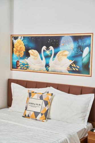 Postel nebo postele na pokoji v ubytování CiCi Hotel Hải Phòng