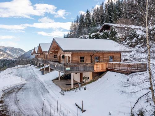 a log cabin in the snow with a driveway at Chalet Chalet Venus by Interhome in Patergassen