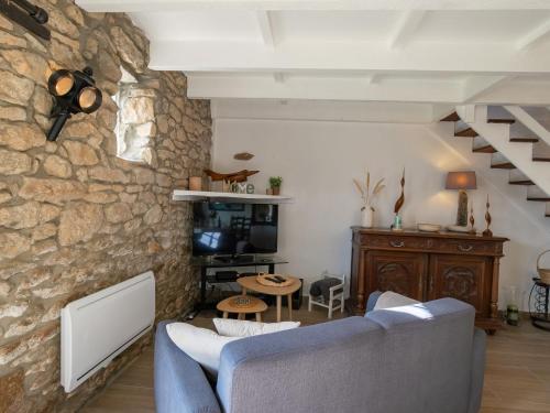 Televízia a/alebo spoločenská miestnosť v ubytovaní Holiday Home Ty Lez by Interhome