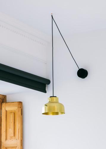 two lights hanging from a ceiling with a door at Guest House Ibaia Et Arramak in Donostia-San Sebastián