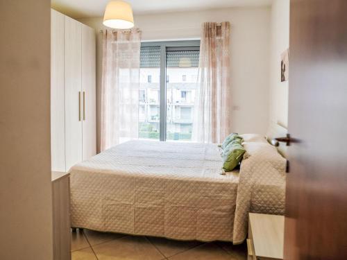 Postel nebo postele na pokoji v ubytování Apartment Le Dune by Interhome