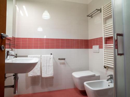 a bathroom with a white toilet and a sink at Apartment Le Dune by Interhome in Silvi Marina