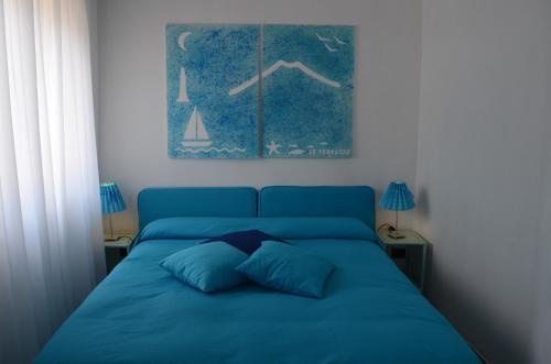 a blue bed with two pillows in a bedroom at Residence Le Terrazze in Sorrento