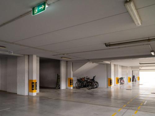 an empty parking garage with bikes parked in it at Apartment Le Dune by Interhome in Silvi Marina