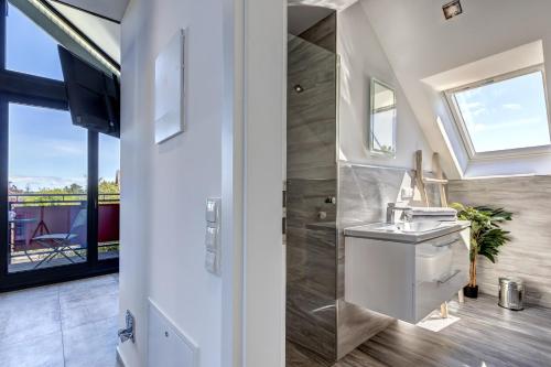 a bathroom with a sink and a shower at Ferienwohnung Carlotta in Trassenheide
