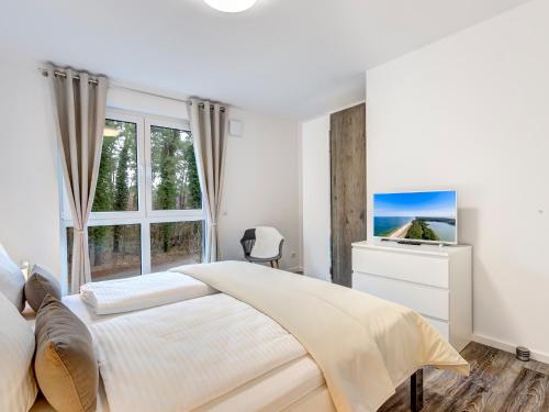 Giường trong phòng chung tại Bernsteinquartier BQ0557 - Bonjour