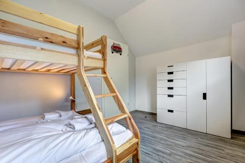 Postel nebo postele na pokoji v ubytování Haus Füürtoorn mit Fass-Sauna