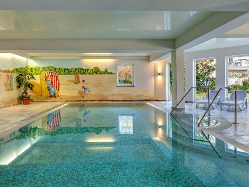 a swimming pool in a house with a slide at Ostseeresidenz Gorki- Park - 07 mit Wellness und Schwimmbad in Bansin