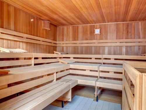 an empty sauna with wooden walls and wooden benches at Ostseeresidenz Gorki- Park - 07 mit Wellness und Schwimmbad in Bansin