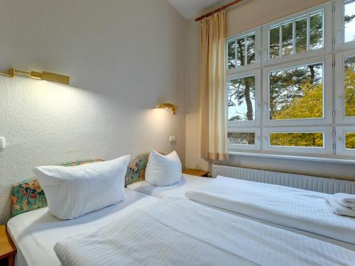 Postel nebo postele na pokoji v ubytování Villa Daheim - FeWo 03