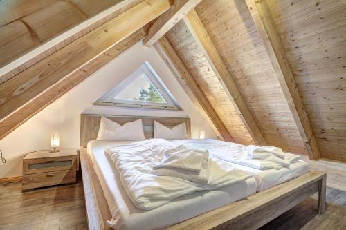a bedroom with a bed in the attic at Haus Störtebeker in Ueckeritz