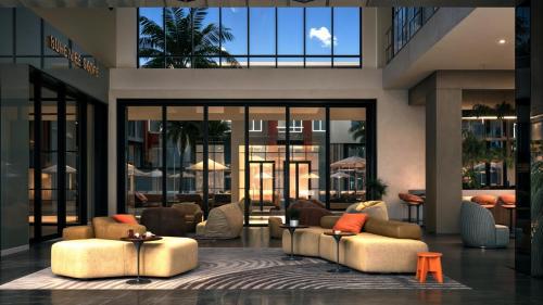 a lobby with couches and tables in a building at Otonomus Hotel Las Vegas in Las Vegas