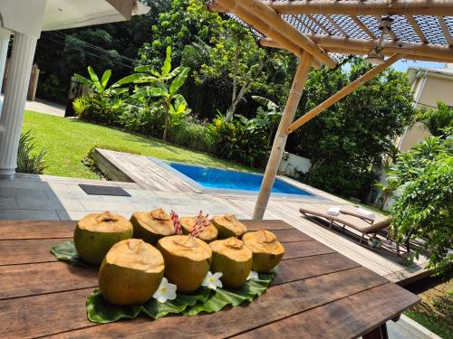 a plate of food on a table near a pool at Kaz Memel in Beau Vallon