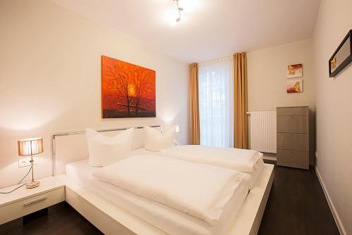 Ένα ή περισσότερα κρεβάτια σε δωμάτιο στο Residenz am Balmer See - BS 05 mit Wellnessbereich