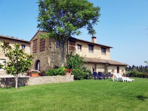 a large stone building with a tree in the yard at Holiday Home Linearis K by Interhome in SantʼAppiano
