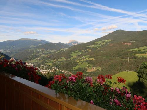 a view of a valley with flowers on a fence at Apartment Residence Egger - n-301 by Interhome in Villandro