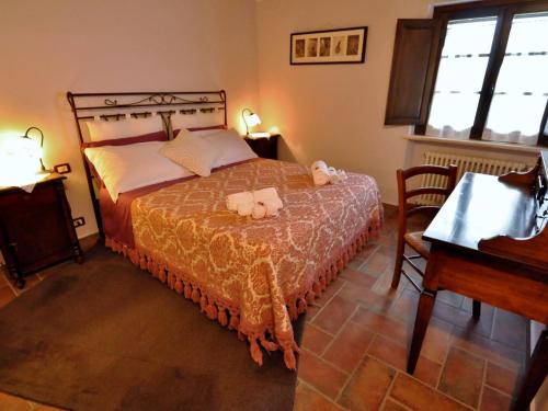 a bedroom with a bed with two stuffed animals on it at Apartment Linearis B by Interhome in SantʼAppiano