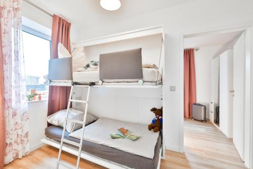 Ένα ή περισσότερα κρεβάτια σε δωμάτιο στο Auszeit in Poseritz auf Rügen
