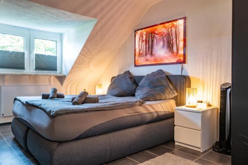 a bedroom with a bed with two teddy bears on it at #622 gemütliche Wohnung mit Disney,Prime und Netflix in Essen