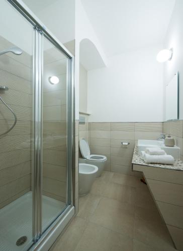 a bathroom with a shower and a toilet and a sink at B&B Belvedere in Agropoli