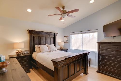 a bedroom with a bed and a ceiling fan at Golf and Hike Family Home with Patio in Glendale in Phoenix