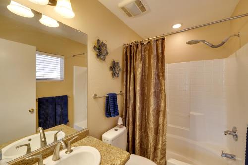 a bathroom with a sink and a shower at Golf and Hike Family Home with Patio in Glendale in Phoenix