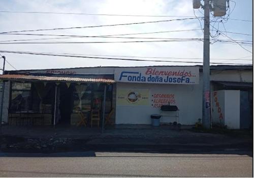 a building with a sign on the side of it at Residencial D' Caché in Aguadulce