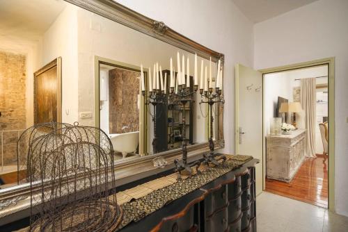 a mirror on the wall in a living room at The Stone House in Zaton
