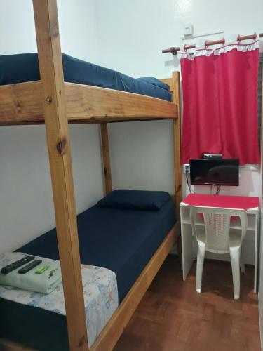 Ένα ή περισσότερα κρεβάτια σε δωμάτιο στο Quartos no centro de Itu - Hospedagem Elizabeth