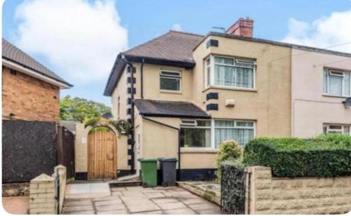 a house with a gate and a fence at Birmingham 3 bedrooms- Sleeps 6- Free parking in Kidderminster