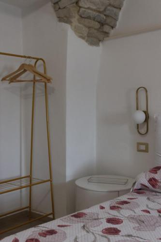 a bedroom with a bed and a toilet in a room at Il Viandante Bed & Breakfast in Roseto Valfortore