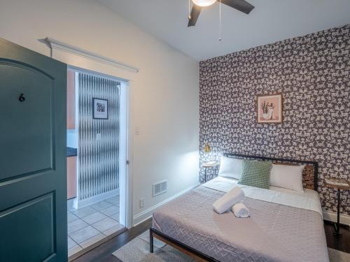 a bedroom with a bed and a brick wall at Wrigleyville Suites in Chicago