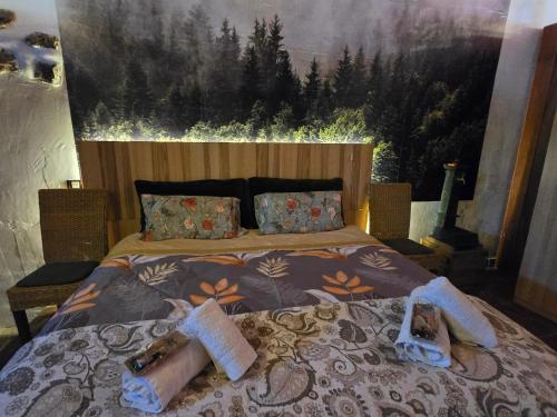 a bedroom with a bed with a large painting on the wall at Sea view apartment in San Cristóbal de La Laguna - 70 sqm in La Laguna