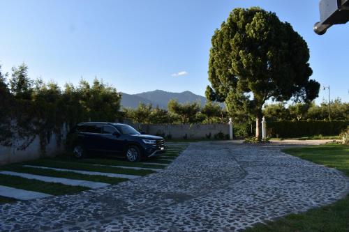 a car parked on the side of a driveway at Villa Cristal in Antigua Guatemala