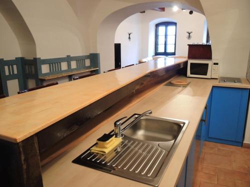 a kitchen with a sink and a counter top at VIP MiKU apartman 1 in Mikulov