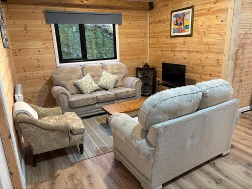 Posezení v ubytování Rosies Cabin Maum