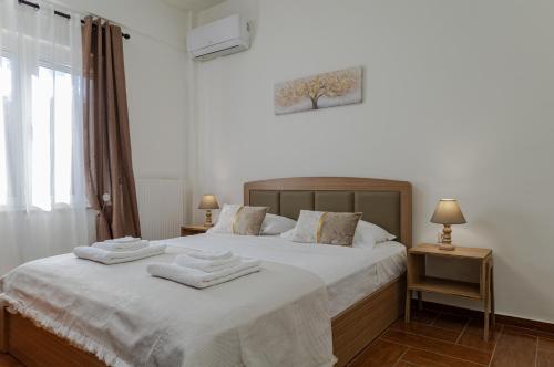 A bed or beds in a room at Vasiliki house