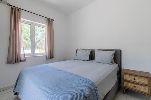 Postel nebo postele na pokoji v ubytování Villa Xamadochori