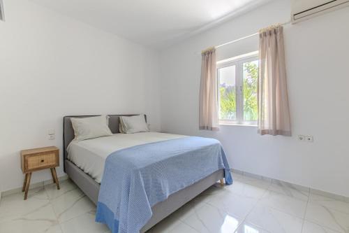 Postel nebo postele na pokoji v ubytování Villa Xamadochori