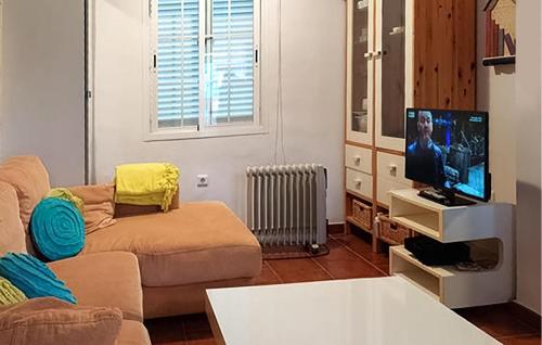 a living room with a couch and a flat screen tv at Awesome Home In Islantilla - Lepe in Islantilla