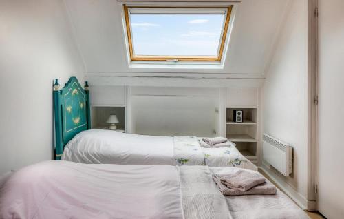 a bedroom with two beds and a window at Gorgeous Home In Luneray With Wifi in Luneray