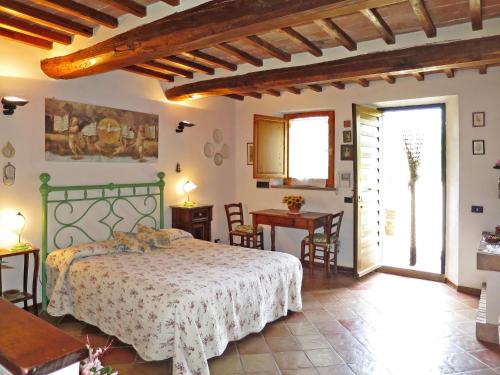 Ένα ή περισσότερα κρεβάτια σε δωμάτιο στο Apartment Podere Fontemaggio - Monolocale by Interhome