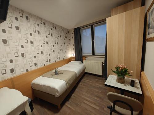 Postel nebo postele na pokoji v ubytování Hotel Tropicana