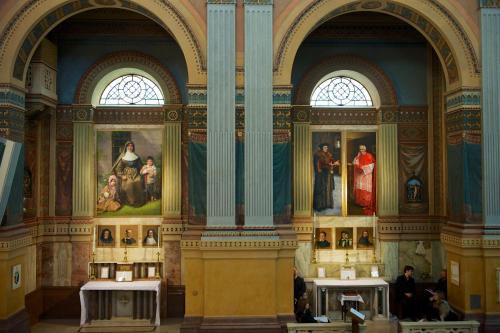 a large room with paintings on the walls of a museum at Domus Australia in Rome