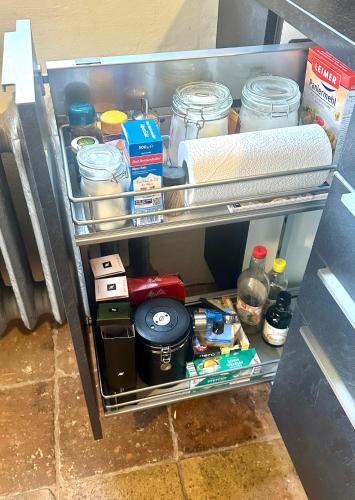 a refrigerator filled with lots of food and drinks at Ferienhaus Ickelhaus 1 in Bad Windsheim