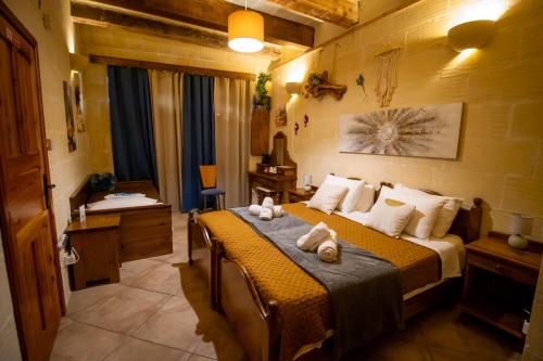 Ein Bett oder Betten in einem Zimmer der Unterkunft Il figolla farmhouse
