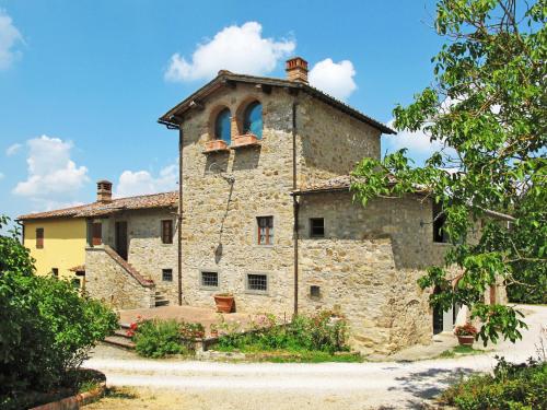 an old stone building with two windows on it at Holiday Home Reggine-3 by Interhome in Panzano
