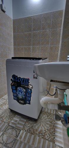 a bathroom with a toilet and a sink at Ocean Breeze Homes 1, 2 or 3 bedroom Watamu in Watamu