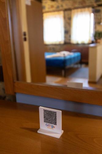 a scale sitting on a table in front of a mirror at Suites Mouses in Palaios Agios Athanasios