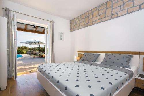 Postel nebo postele na pokoji v ubytování Villa Bajadera
